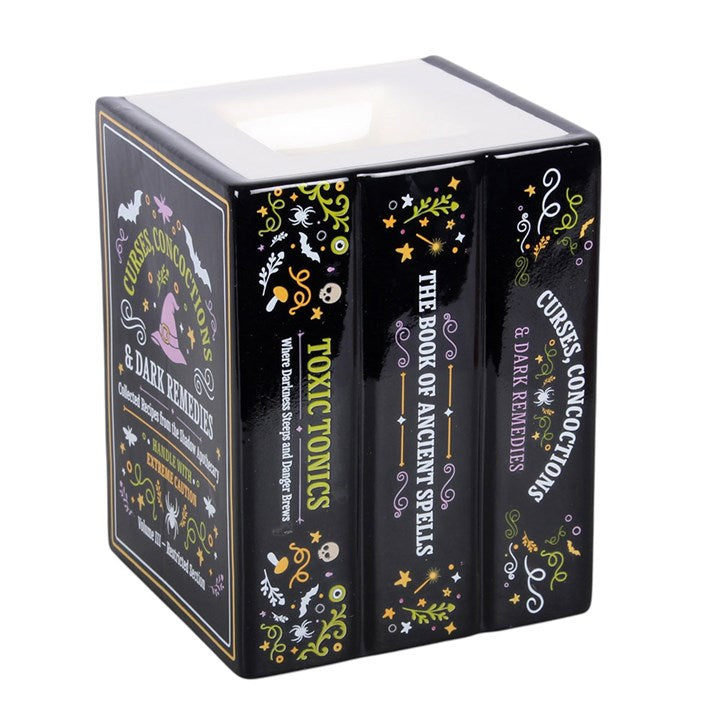 Quemador de aceite y calentador de cera con forma de libro de la botica de la bruja